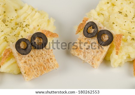 Portion of a creative kid meal with mashed potatoes