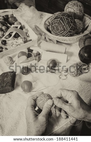 Expert hands crafting traditional sport balls