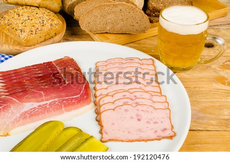 Cold meat, pickles, whole wheat bread and beer, a traditional German cold meal