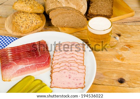 Cold meat, pickles, whole wheat bread and beer, a traditional German cold meal