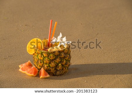 Refreshing pineapple cocktail served inside a whole fruit
