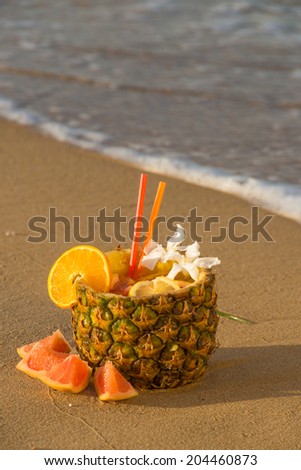 Fruity drink served inside a pineapple shell