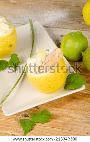 Homemade lemon sorbet served inside an empty lemon half