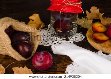 Plum brandy and its ingredients in a autumnal setting