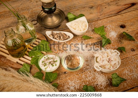 Natural cosmetics ingredients displayed on a rustic table