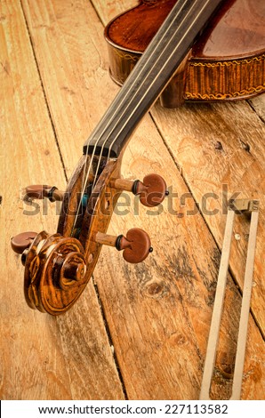 Violin neck and a tuning fork, a musical concept