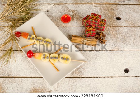 Fruity Christmas dessert set up and decorated as a kid meal