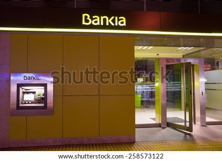 MADRID, SPAIN - FEBRUARY 24, 2015: A Bankia branch. Bankia was the result of a merger of several failed savings banks and has been in the eye of several political scandals since.