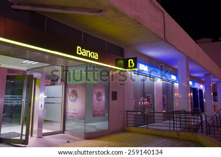 MADRID, SPAIN - FEBRUARY 24, 2015: A Bankia branch. Bankia was the result of a merger of several failed savings banks and has been in the eye of several political scandals since.