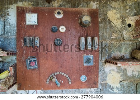 Vintage electrical switchboard with multiple controls, fuses and levers