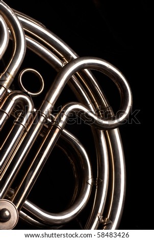 Detail of the coiled pipes of a French horn