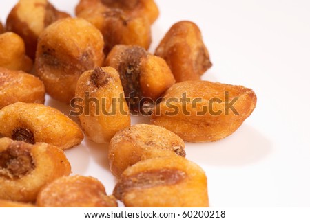 Freslhy fried corn seeds isolated with copy space