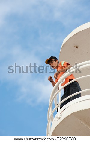 Lifeguard on duty on top of a watch-tower