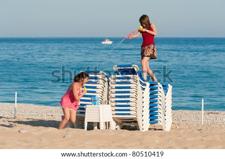 Crazy girls having a lot of fun at a water fight