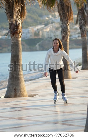 Woman enjoying a sunny afternoon on her rollerblades