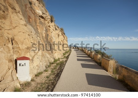 Scenic old coastal road winding over the Mediterranean