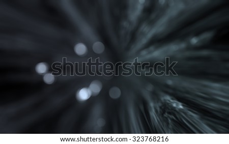 Light particles in motion effect. Radial motion blur / zooming effect.