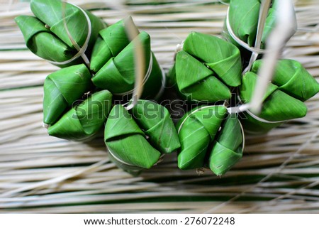 Thai sticky rice dessert wrapped in a leaf Banana