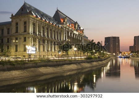 Bucharest, Romania - August 4, 2015: Dimbovita River and the Justice Palace in Unirii Square.