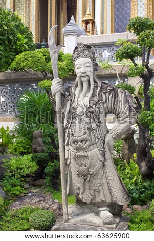Stone statue of a standing warrior Wat Phra Kaeo Palace in Bangkok