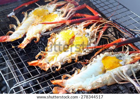Grilled prawns and lobster on the grill