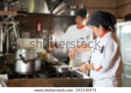 Blurred Cooking : Groups of Chef cooking in the kitchen