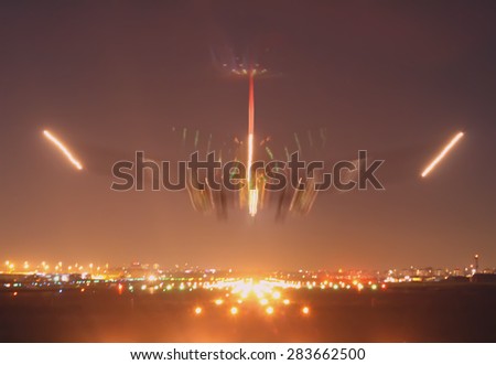 there is an aircraft just before the touch down with long exposure taking shows its landing movement