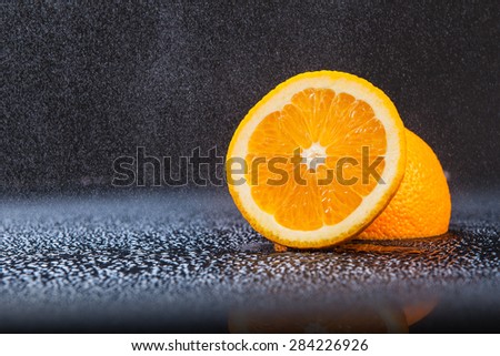 orange background black blue drops spray
