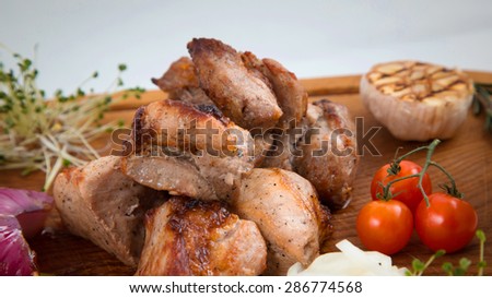 meat onions pepper cherry tomatoes pork beef chicken grilled vegetables sauce board background white