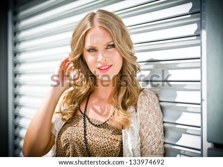 fashion urban portrait of beautiful model on the street.High fashion urban portrait of young, slim, beautiful model.