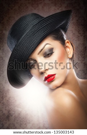 Beautiful woman portrait. Fashion art photo.Beautiful young model in hat on the background in studio.elegant female portrait wearing hat isolated.Romantic Beauty.Retro Style
