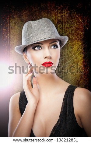 Beautiful woman portrait. Fashion art photo.Beautiful young model in hat on the background in studio.elegant female portrait wearing hat isolated.Romantic Beauty.Retro Style