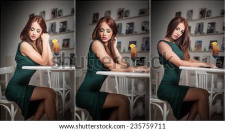 Fashionable attractive young woman in green dress sitting in restaurant. Beautiful redhead posing in elegant scenery with an orange juice glass on the table. Pretty female relaxing, indoor shot.