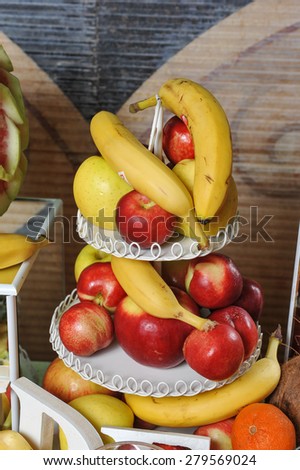 Carved fruits arrangement. Fresh various fruits. Assortment of exotic fruits. Fresh fruits decoration
