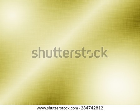 Metal gold background or texture of brushed steel plate with reflections