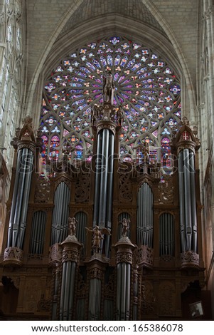 TOURS, FRANCE - JUNE 24, 2013: Stained glass window and organ of Saint Gatien cathedral in Tours, France. .
