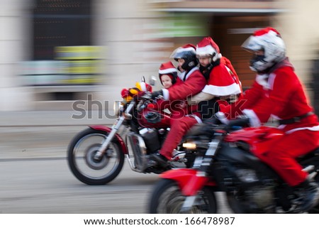 Cracow, Poland - December 8, 2013: The Parade Of Santa Clauses On Motorcycles Around The Main Market Square In Cracow