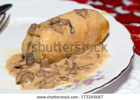 cabbage stuffed roll with mushroom sauce