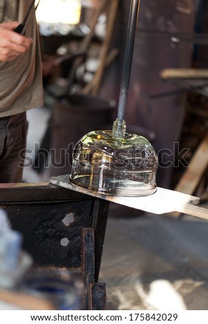 glass blower carefully making his product