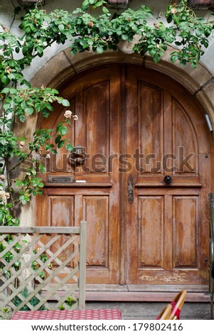 Wooden door in Eguisheim village along the famous wine route in Alsace, France