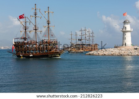 ALANYA, TURKEY - JUNE 13, 2014: Tourists enjoying sea journey on vintage sailships on june 13 2014 in Alanya, Turkey. Alanya is one of the most famous tourism industry centers in Turkey.