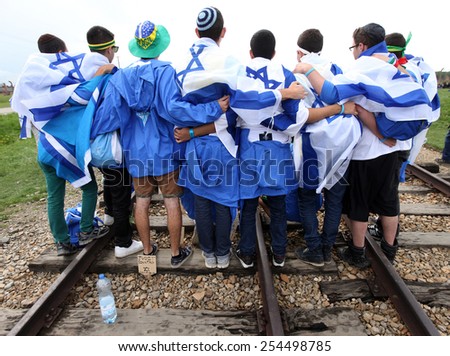 AUSCHWITZ, POLAND - APRIL 24, 2014: The next generation of Tourists from Israel are visiting german Concentration Camp in Auschwitz Birkenau.Poland