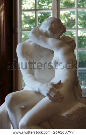 PARIS, FRANCE - SEPTEMBER 12, 2014:The Kiss, a famous statue by Auguste Rodin in Rodin Museum in Paris