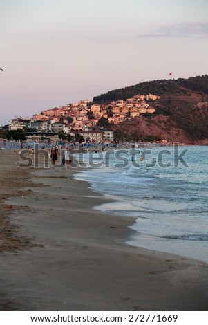 ALANYA, TURKEY - JUNE 23, 2014: Alanya - Late afternoon on Cleopatra Beach. Alanya is one of most popular seaside resorts in Turkey
