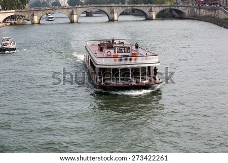 PARIS, FRANCE - SEPTEMBER 7, 2014: Boat tour on Seine river in Paris, France