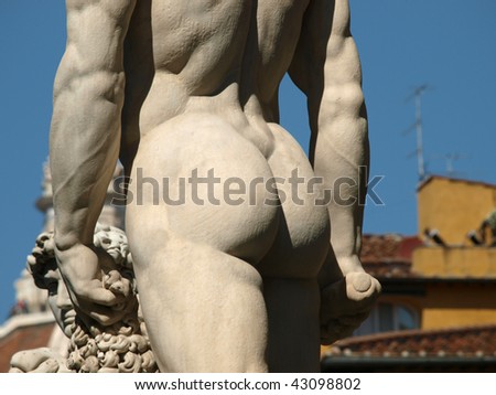 The white marble sculpture Hercules and Cacus is to the right of the entrance of the Palazzo Vecchio in the Piazza della Signoria, Florence, Italy.
