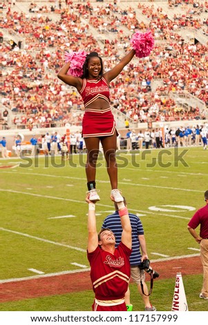TALLAHASSEE, FL - OCT. 27:  Florida State male cheerleader supports a female cheerleader during a FSU vs Duke University football game at Doak Campbell Stadium on Oct. 27, 2012.