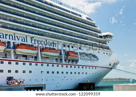 KEY WEST, FL - JULY 11:  Passengers boarding Carnival\'s Freedom ship after a day in Key West on July 11, 2011. In 1984, the city improved Mallory Dock, making it a full cruise ship docking facility.