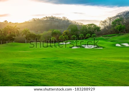 Landscape of a beautiful tropical golf course at sunset