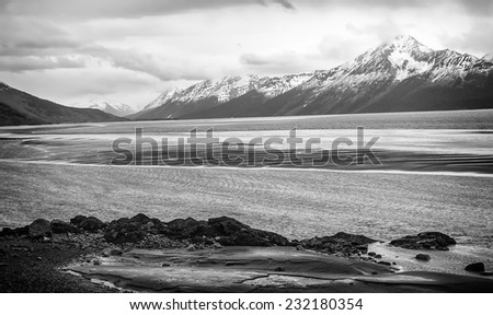 Alaska\'s scenic landscape, the snow capped mountains and rivers that run along the shore near Anchorage.